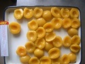 canned yellow peach halves - product's photo